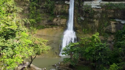 Aerial View of a Small Beautiful Waterfall The Drone Moves Away From the Waterfall a Tourist Spot