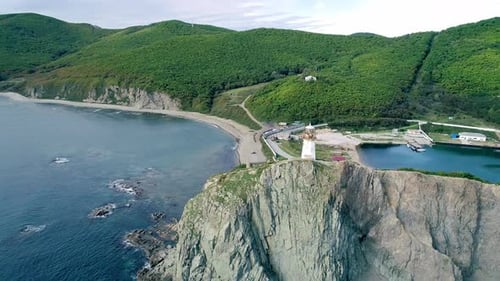 Aerial Orbital View of an Old Lighthouse on the Cliff on Pacific Coast Beautiful Panoramic Seascape