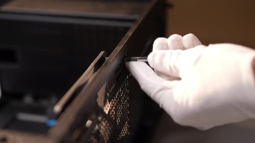 Hand Screws in a Computer Case with Screwdriver