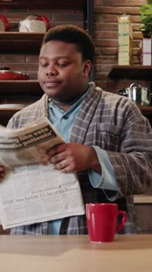 Relaxing Casual Morning Vibes at Home with a Cup of Coffee and Catching Up on the News