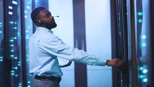 IT Technician Working in Data Center Server Room