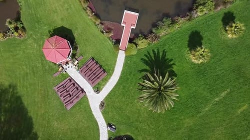 drone down from sky to the lawn and wedding pavilion pinky