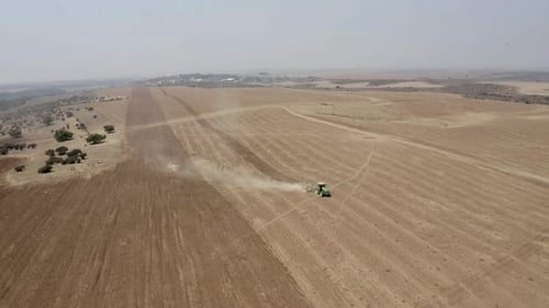 Tractor tilling in Judea Plain, Drone footage, Israel