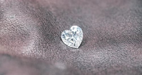 Heart Diamond Sparkles on Dark Textured Surface