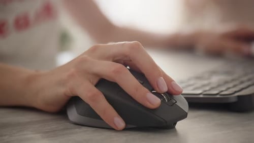 Close Up of Woman Using Computer Mouse