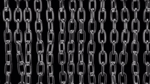 The camera moves through the chains and pushes them apart. The path to freedom.