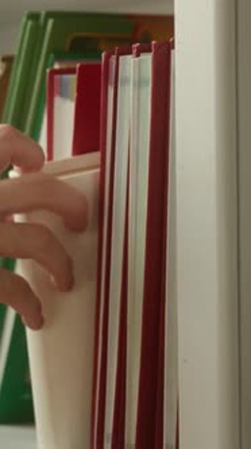 Close Up Male Student Hand Choosing Take Book From Shelf in Library University Unrecognizable Man