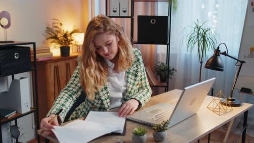 Woman Working at Desk in Home Office