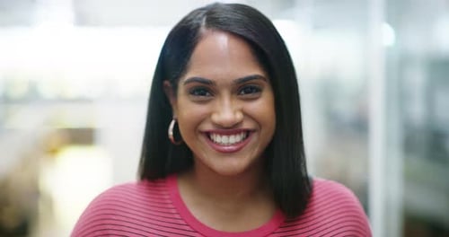 Woman Smiling and Looking at Camera in Workplace