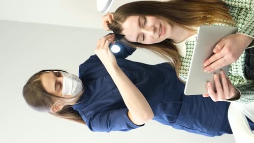 Computer Trichoscopy A Trichologist Examines a Patient's Hair with a Trichoscope in a Clinic
