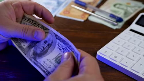 Bank Employee Hands Counting US Dollar Bills