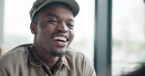 Happy, laugh and black man in cafe with friend for discussion, funny conversation and talking