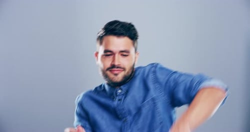 Enthusiastic Young Adult Dancing Vigorously in Studio