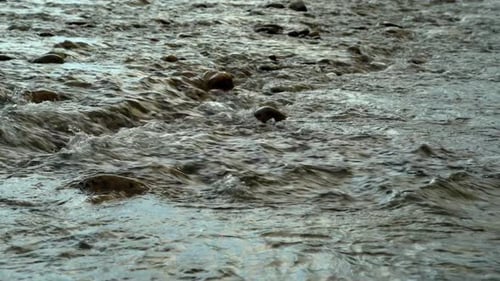 Fast Water Flows Through The Stones