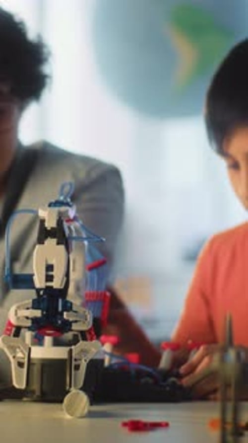 Engineering Lesson Elementary School Student Studying Model of Innovative Robotic Arm