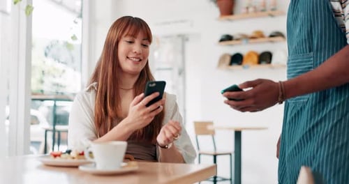 Customer service, cafe and mobile payment for breakfast, food and waffles with POS machine