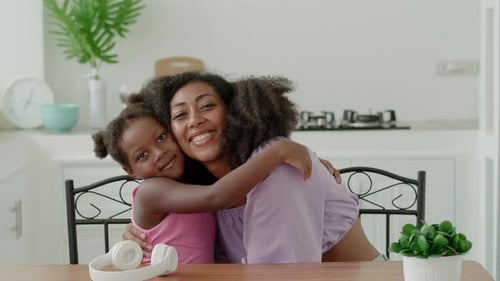 Affectionate Mother and Child Embrace in Kitchen