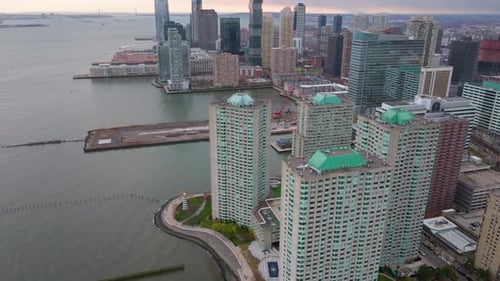 Panoramic Drone View Revealing Jersey City Skyline Waterfront Expanse with Residential Buildings and