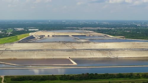 Aerial View of Massive Landfill Surrounded by Water