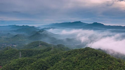 Time lapse video aerial view morning scenery Mist flowing over the high mountains.
