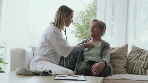 Health Visitor and a Senior Woman During Home Visit