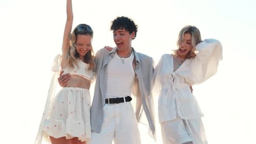 Man and two women at seaside