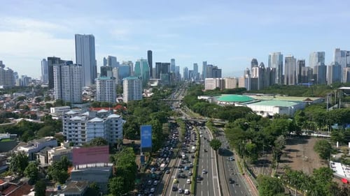 Aerial Drone View of Busy Traffic and Modern Skyline in Jakarta Indonesia