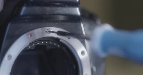 Professional Camera Repair by hand, screwing in Macro close up real time