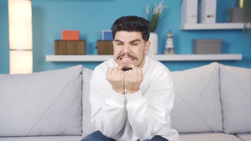 Angry young man. Gestures.