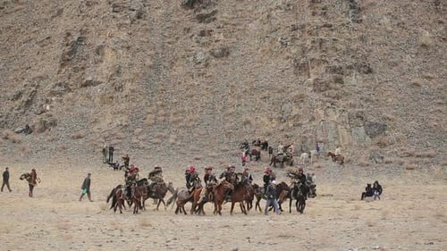 Bayan-Ulgiy, Mongolia - November 5, 2014: Festival Golden Eagle Hunting. Nomads With Eagles Ridin...
