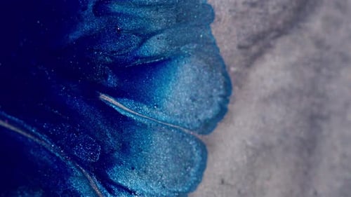 Metallic Blue and Silver Abstract Paint Swirls