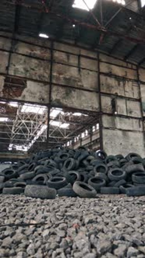 Bunch of tires from wheels. Pile of used tires lays at an old dump
