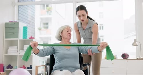 Senior Woman Exercising with Resistance Band at Home
