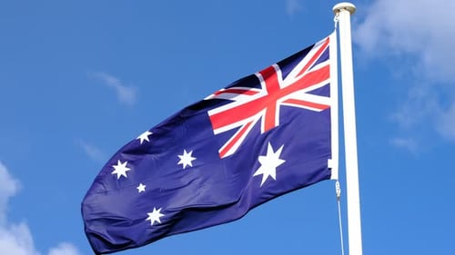 Australian Flag Waving in the Wind on a Sunny Day