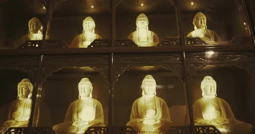 Small Luminous Buddhas In The Temple