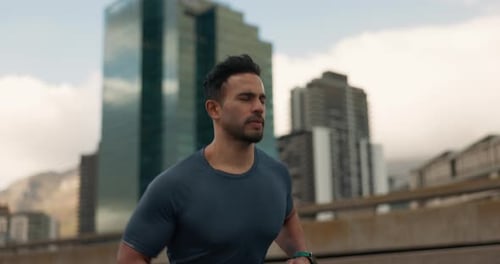 Running, fitness and man in city on street for marathon training, exercise and cardio workout