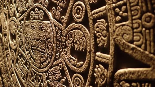 Intricate Stone Carving Artwork in Dark Gold