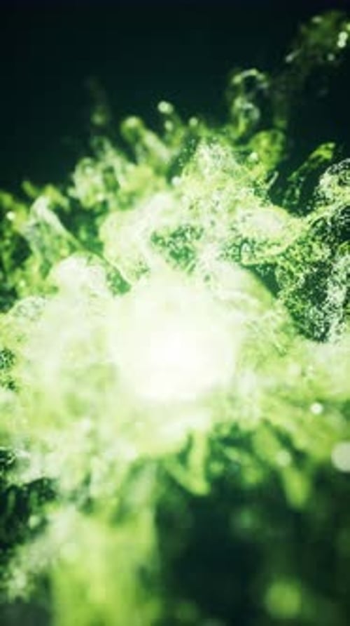 Green flowing particles with explosive wave effect