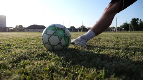 Male Foot of Professional Footballer Shooting a Penalty Kicks on Stadium at Sunset Leg of Sportsman