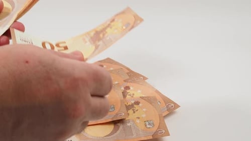 Hand Counting Many Fifty Euro Banknotes