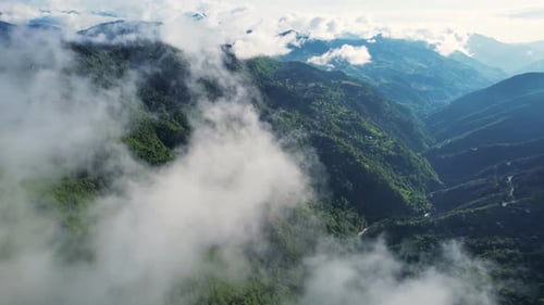 Flying Through The Clouds. Sunny Green Mountains Background