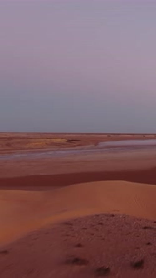 Aerial view flying over the beautiful sand dunes of the Sahara desert. Stunning landscape during a