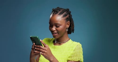 Laugh, scroll and black woman in studio with phone, communication and funny post on social media