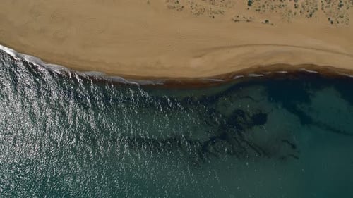 Scenic View Sand Beach And Blue Sea Surface. Drone Shot Tranquil Coastline With Calm Waves Splash...