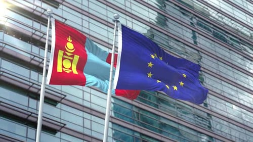Mongolia and European Union Flags Waving Against Modern Building