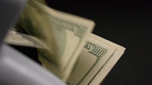 Money Counting Machine Processes Hundred Dollar Bills