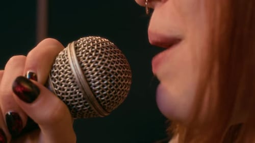 Singer Performing with Microphone in Close Up