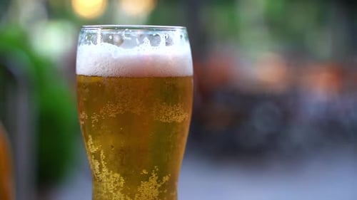 Beer in a Glass on the Background of the Street