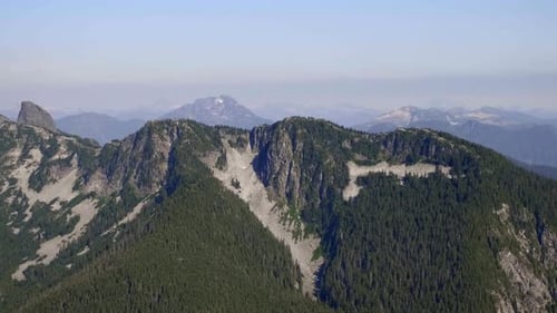 Beautiful Mountain Range Landscape with Green Forested Slopes AERIAL