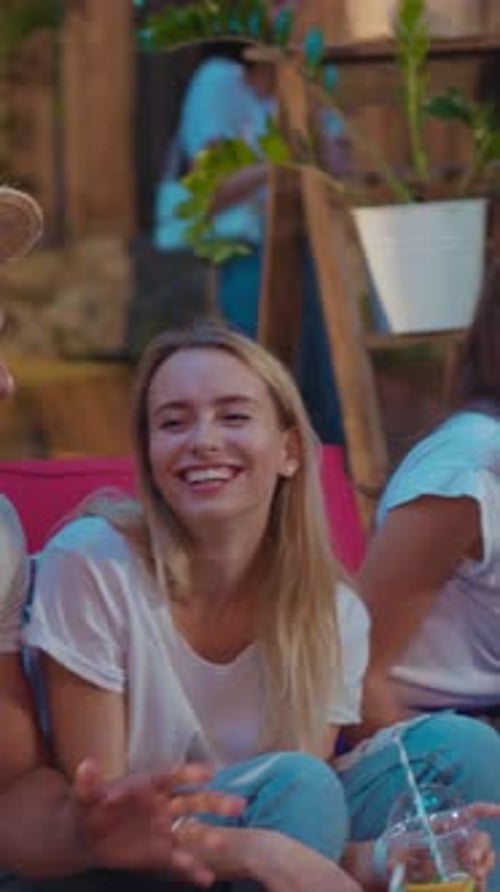Young Adults Celebrate at Cheerful Outdoor Party